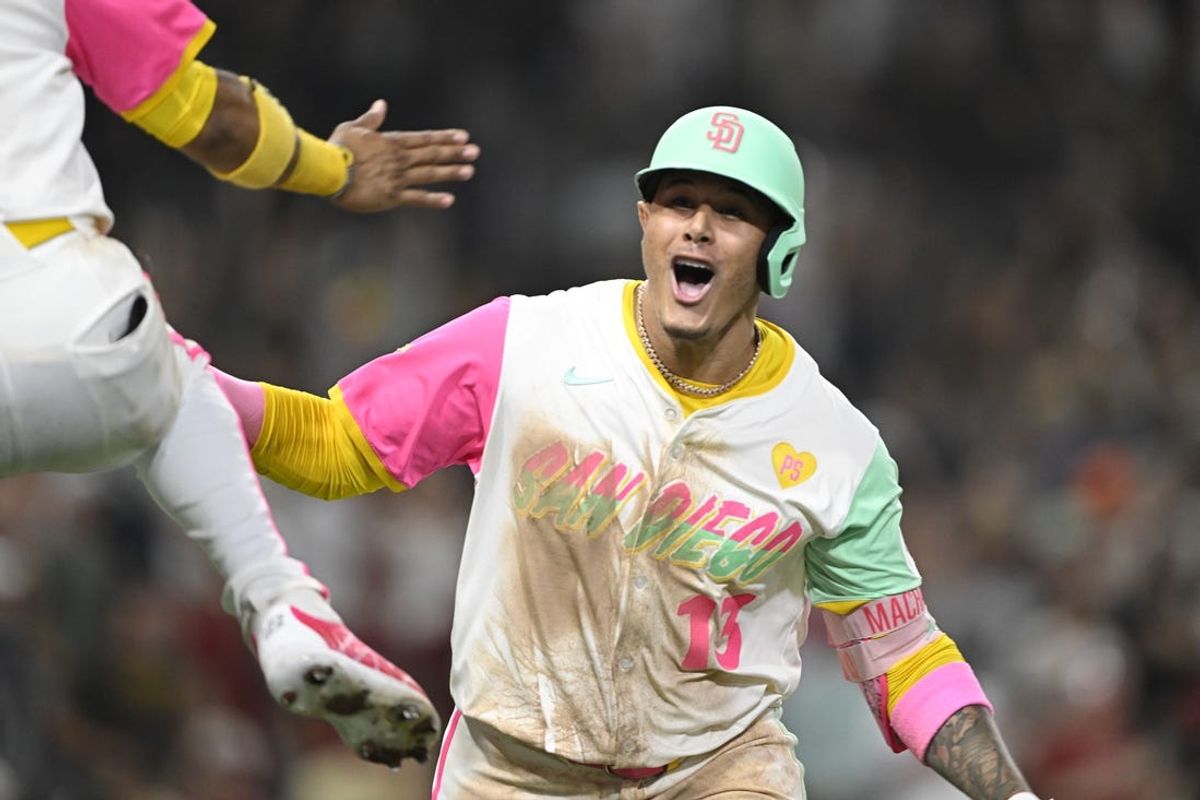 July 5, 2024; San Diego, California, USA; San Diego Padres third baseman Manny Machado (13) celebrates after hitting a walk-off home run during the ninth inning against the Arizona Diamondbacks at Petco Park. Mandatory Credit: Denis Poroy-USA TODAY Sports