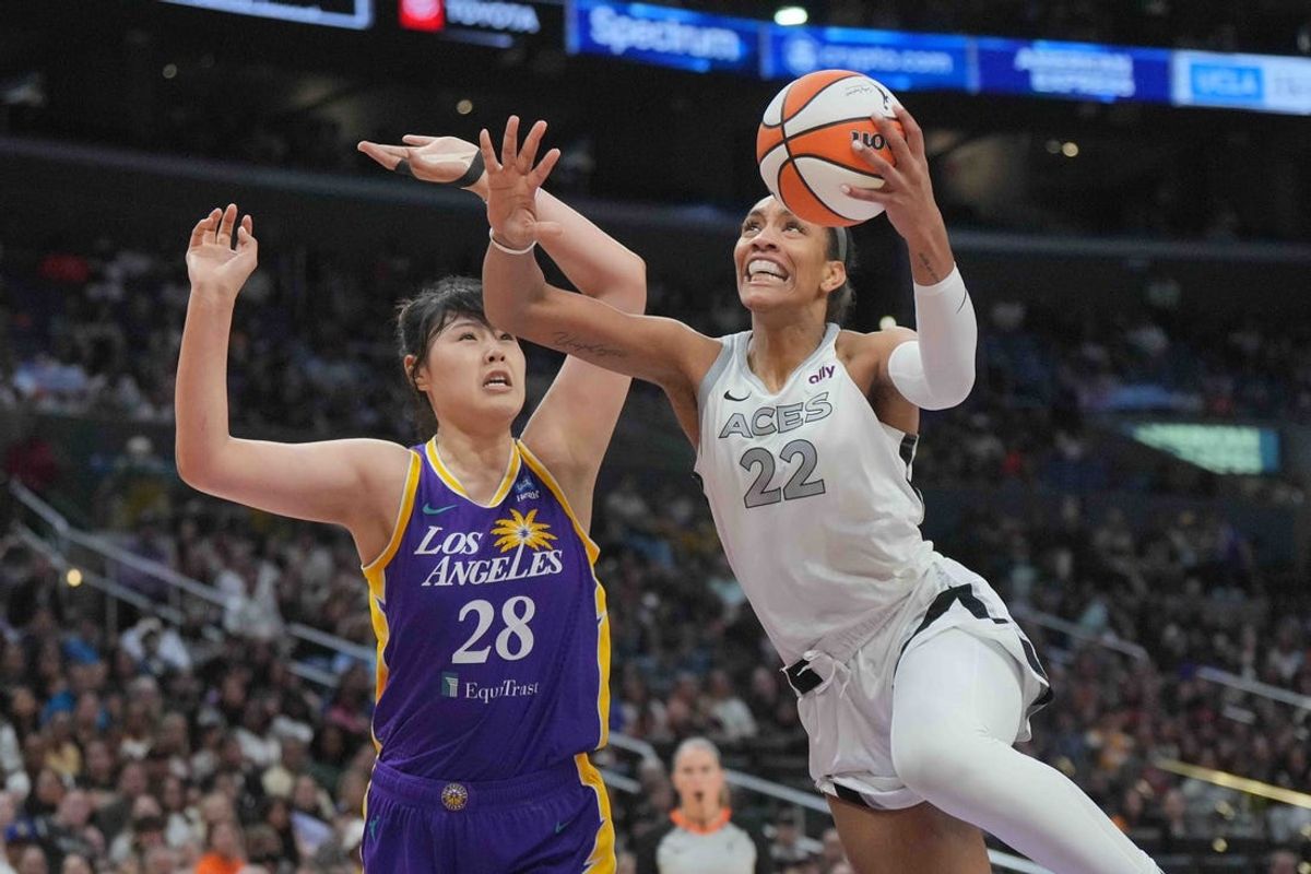 Jul 5, 2024; Los Angeles, California, USA; Las Vegas Aces center A'ja Wilson (22) shoots the ball against LA Sparks center Li Yueru (28) in the second half at Crypto.com Arena. Mandatory Credit: Kirby Lee-USA TODAY Sports