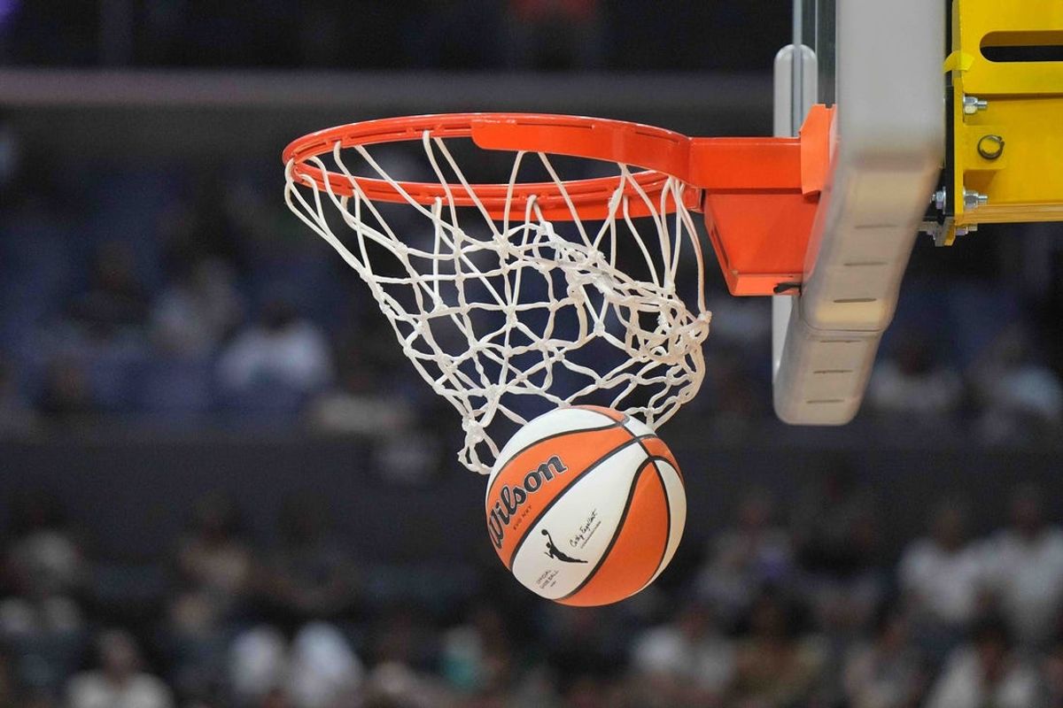 Jul 5, 2024; Los Angeles, California, USA; A WIlson official WNBA Evo NXT basketball approaches the rim and the net at Crypto.com Arena. Mandatory Credit: Kirby Lee-USA TODAY Sports
