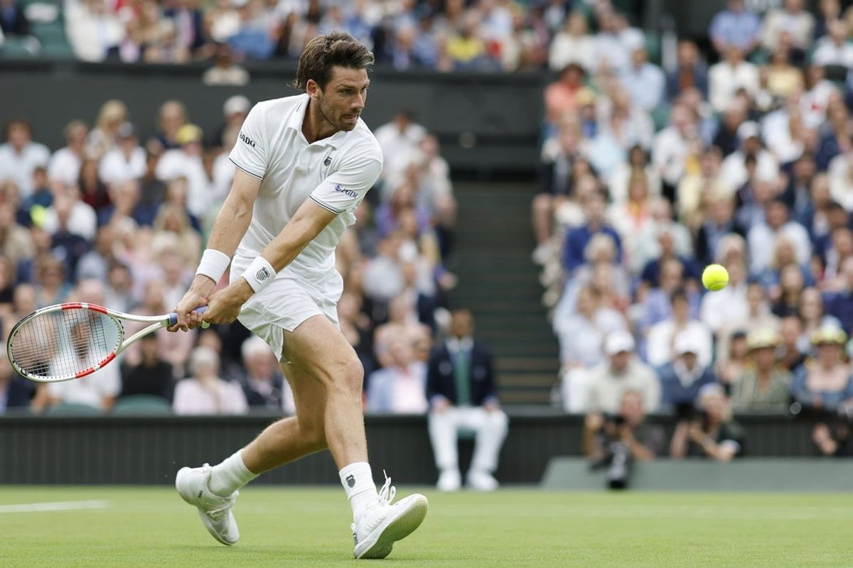 Jul 6, 2024; London,  United Kingdom; Cameron Norrie (GBR) hits a backhand against Alexander Zverev (GER)(not pictured) in a gentlemen's singles match on day six of The Championships Wimbledon 2024 at All England Lawn Tennis and Croquet Club. Mandatory Credit: Geoff Burke-Imagn Images