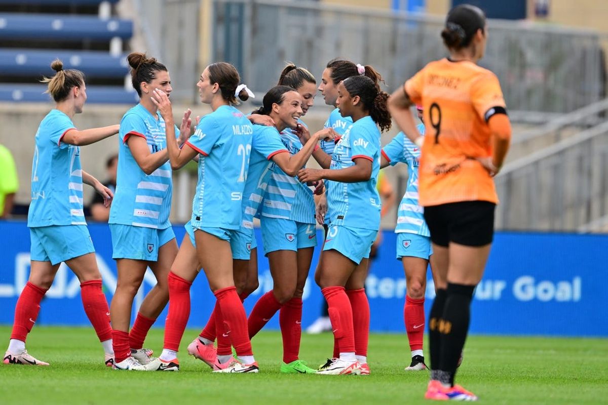 Jul 6, 2024; Bridgeview, Illinois, USA; Chicago Red Stars forward Mallory Swanson (fourth from left) celebrates with teammates after scoring a goal against the Houston Dash during the first half at SeatGeek Stadium. Mandatory Credit: Daniel Bartel-USA TODAY Sports
