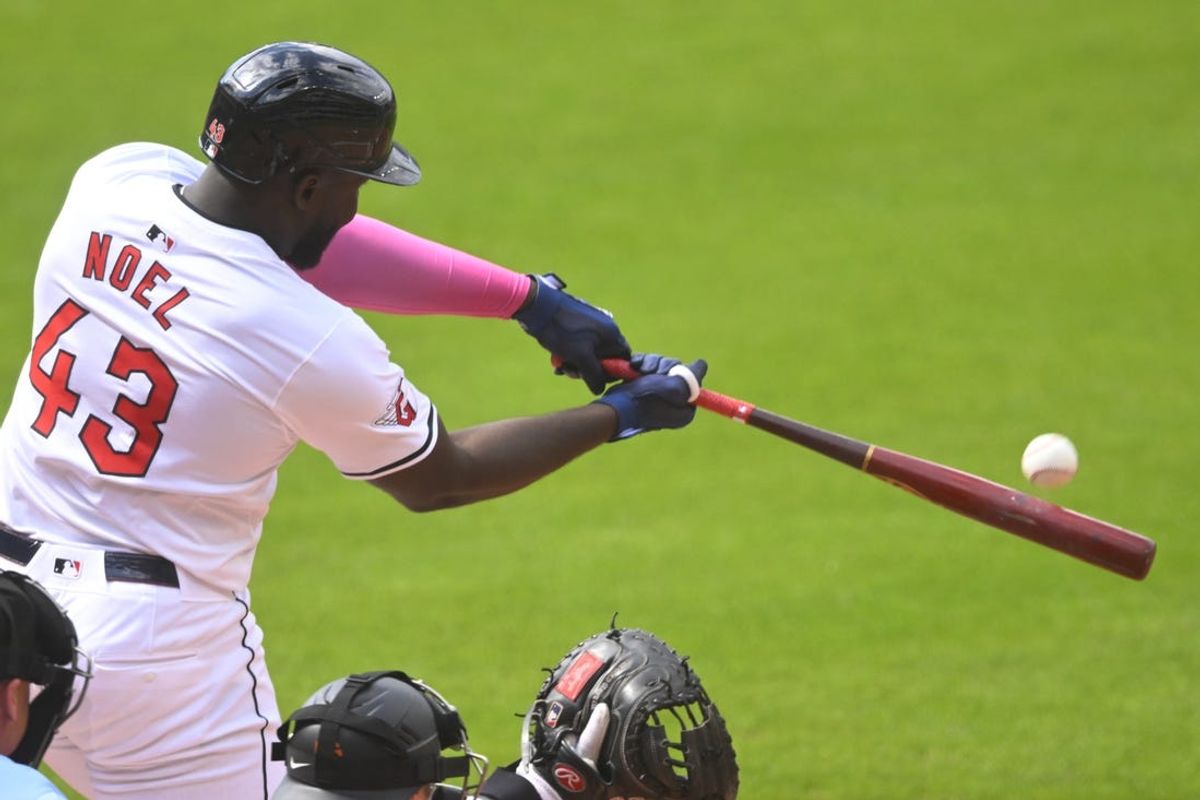 Jul 6, 2024; Cleveland, Ohio, USA; Cleveland Guardians right fielder Jhonkensy Noel (43) hits an RBI sacrifice fly ball in the first inning against the San Francisco Giants at Progressive Field. Mandatory Credit: David Richard-USA TODAY Sports