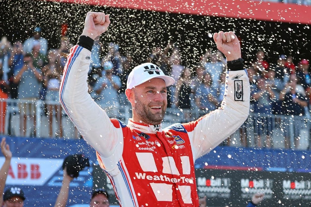 Jul 6, 2024; Chicago, Illinois, USA; Xfinity Series driver Shane Van Gisberaen (97) reacts after winning The Loop 121 at the Chicago Street Race. Mandatory Credit: Mike Dinovo-USA TODAY Sports