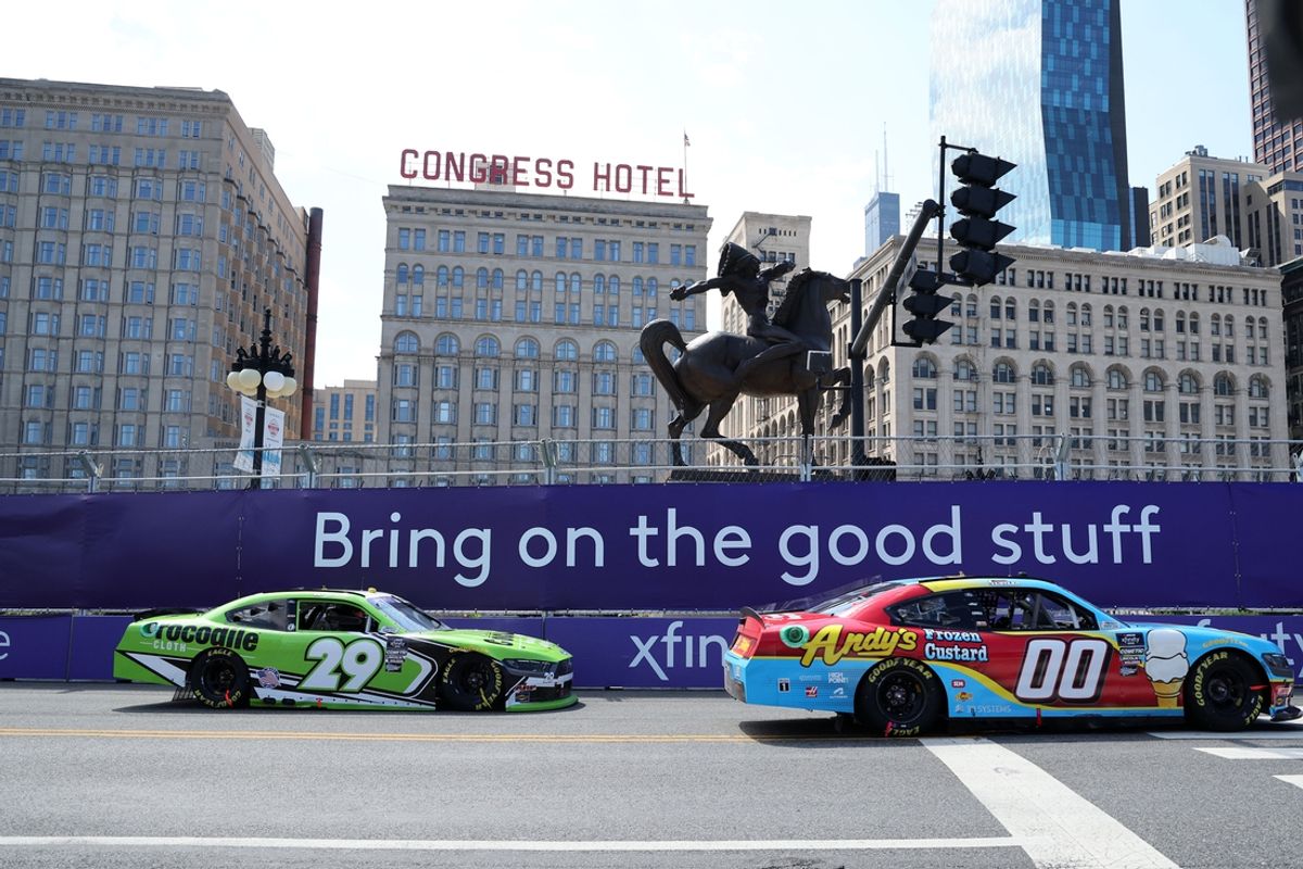 Jul 6, 2024; Chicago, Illinois, USA; Xfinity Series driver Cole Custer (00) leads driver Blaine Perkins (29) during The Loop 121 at the Chicago Street Race. Mandatory Credit: Mike Dinovo-USA TODAY Sports