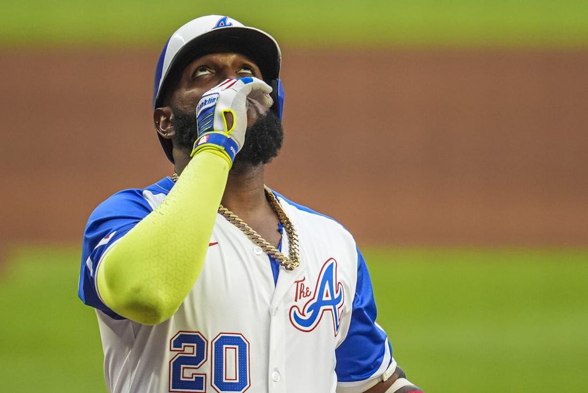 Jul 6, 2024; Cumberland, Georgia, USA; Atlanta Braves designated hitter Marcell Ozuna (20) reacts after hitting a home run against the Philadelphia Phillies during the first inning at Truist Park. Mandatory Credit: Dale Zanine-USA TODAY Sports
