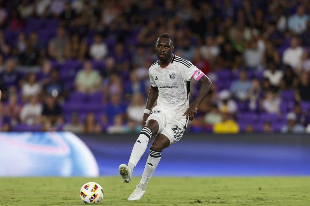 Jul 6, 2024; Orlando, Florida, USA; D.C. United forward Christian Benteke (20) passes the ball against Orlando City during the second half at Inter&Co Stadium. Mandatory Credit: Morgan Tencza-USA TODAY Sports