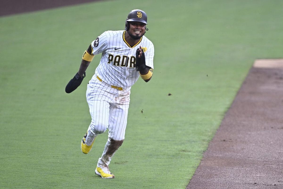 Jul 6, 2024; San Diego, California, USA; San Diego Padres second baseman Luis Arraez (4) advances home to score a run on a single hit by third baseman Manny Machado (not pictured) during the first inning against the Arizona Diamondbacks at Petco Park. Mandatory Credit: Orlando Ramirez-USA TODAY Sports