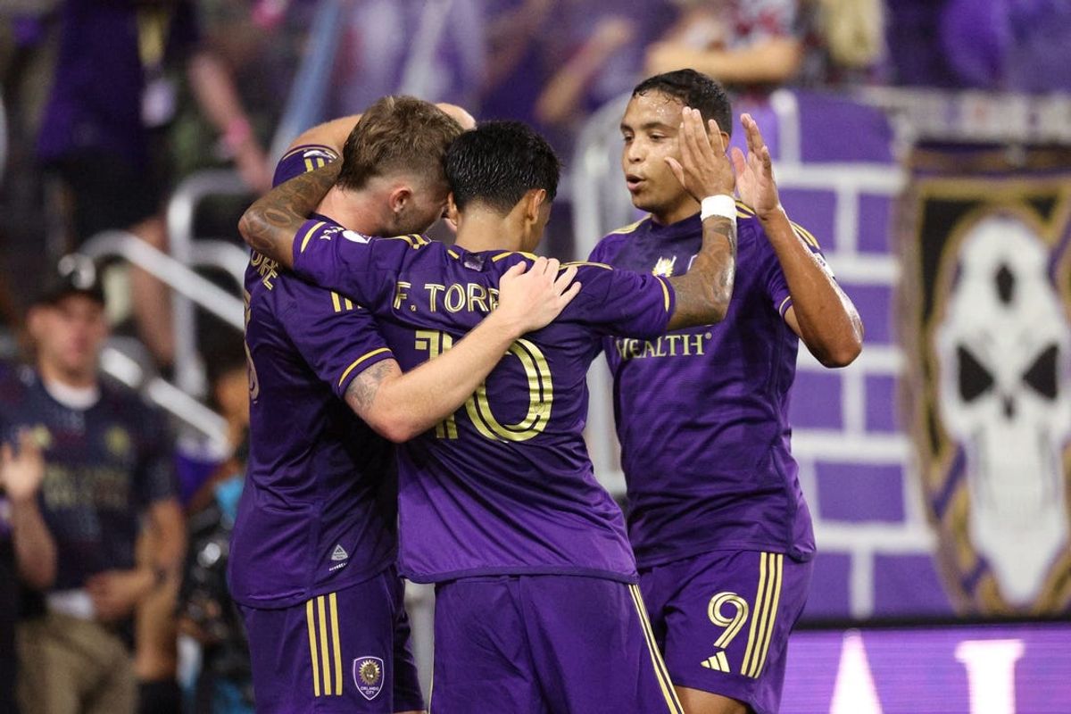 Jul 6, 2024; Orlando, Florida, USA;  Orlando City midfielder Facundo Torres (10) celebrates with forward Duncan McGuire (13) after scoring a goal against D.C. United in the second half at Inter&Co Stadium. Mandatory Credit: Nathan Ray Seebeck-USA TODAY Sports