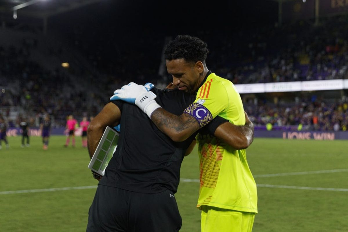 Jul 6, 2024; Orlando, Florida, USA; Orlando City goalkeeper Pedro Gallese (1) celebrates the win over D.C. United with goalkeeper coach César Baena at Inter&Co Stadium. Mandatory Credit: Morgan Tencza-USA TODAY Sports