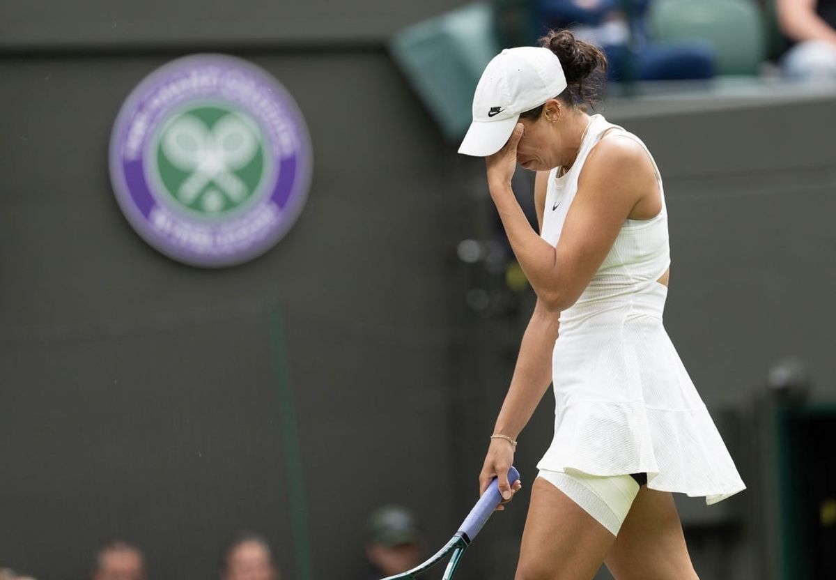 Jul 7, 2024; London,United Kingdom; Madison Keys of the United States reacts to her injury during her match against Jasmine Paolini of Italy (not shown) on day seven of The Championships at All England Lawn Tennis and Croquet Club. Mandatory Credit: Susan Mullane-USA TODAY Sports
