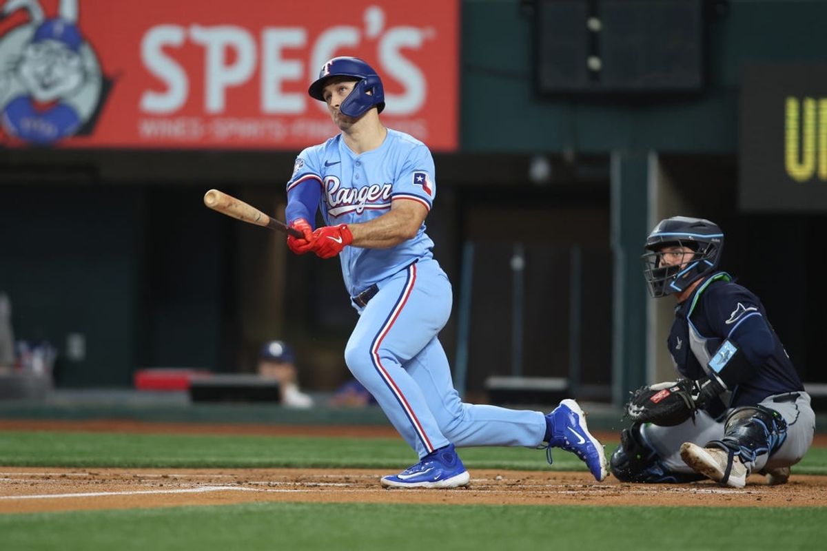 Jul 7, 2024; Arlington, Texas, USA; Texas Rangers left fielder Wyatt Langford (36) drives in a run with a double in the first inning against the Tampa Bay Rays at Globe Life Field. Mandatory Credit: Tim Heitman-USA TODAY Sports