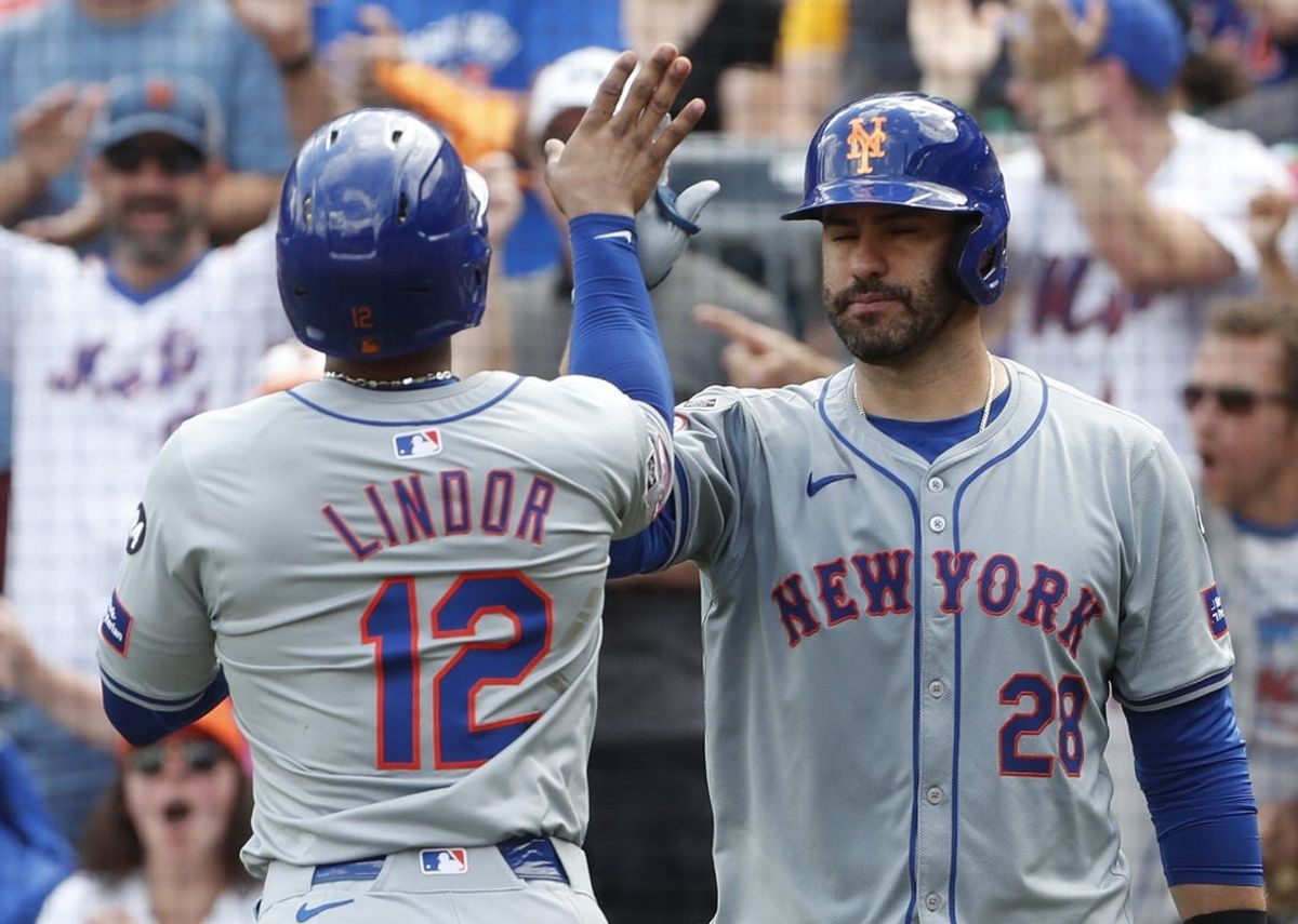 Jul 7, 2024; Pittsburgh, Pennsylvania, USA;  New York Mets designated hitter J.D. Martinez (28) congratulates shortstop Francisco Lindor (12) crossing home plate and scoring a run against the Pittsburgh Pirates during the eighth inning at PNC Park. The Mets won 3-2. Mandatory Credit: Charles LeClaire-USA TODAY Sports