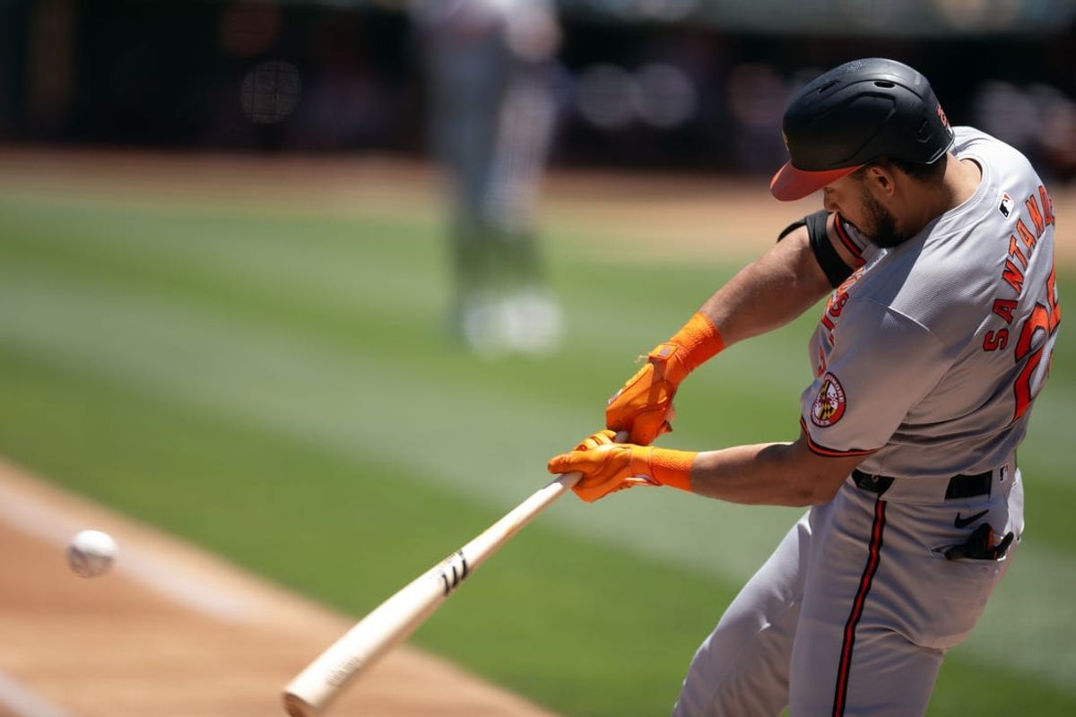 Jul 7, 2024; Oakland, California, USA; Baltimore Orioles right fielder Anthony Santander (25) hits a solo home run against the Oakland Athletics during the first inning at Oakland-Alameda County Coliseum. Mandatory Credit: D. Ross Cameron-USA TODAY Sports