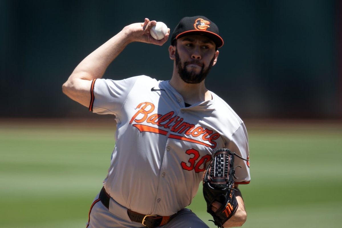 Jul 7, 2024; Oakland, California, USA; Baltimore Orioles starting pitcher Grayson Rodriguez (30) delivers a pitch against the Oakland Athletics during the first inning at Oakland-Alameda County Coliseum. Mandatory Credit: D. Ross Cameron-Imagn Images