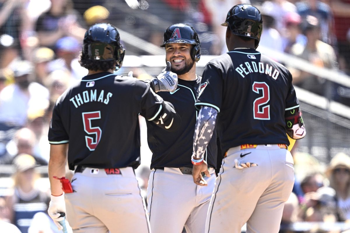 Jul 7, 2024; San Diego, California, USA; Arizona Diamondbacks third baseman Eugenio Suarez (center) celebrates with center fielder Alek Thomas (5) and shortstop Geraldo Perdomo (2) after hitting a two-run home run against the San Diego Padres during the seventh inning at Petco Park. Mandatory Credit: Orlando Ramirez-USA TODAY Sports