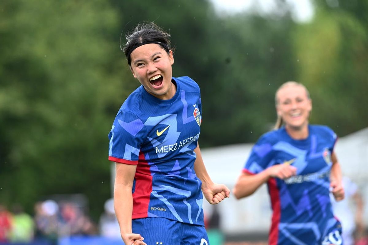 Jul 7, 2024; Cary, North Carolina, USA; North Carolina Courage midfielder Manaka Matsukubo (34) celebrates with forward Olivia Wingate (20) after scoring a goal during the second half at WakeMed Soccer Park. Mandatory Credit: Rob Kinnan-USA TODAY Sports