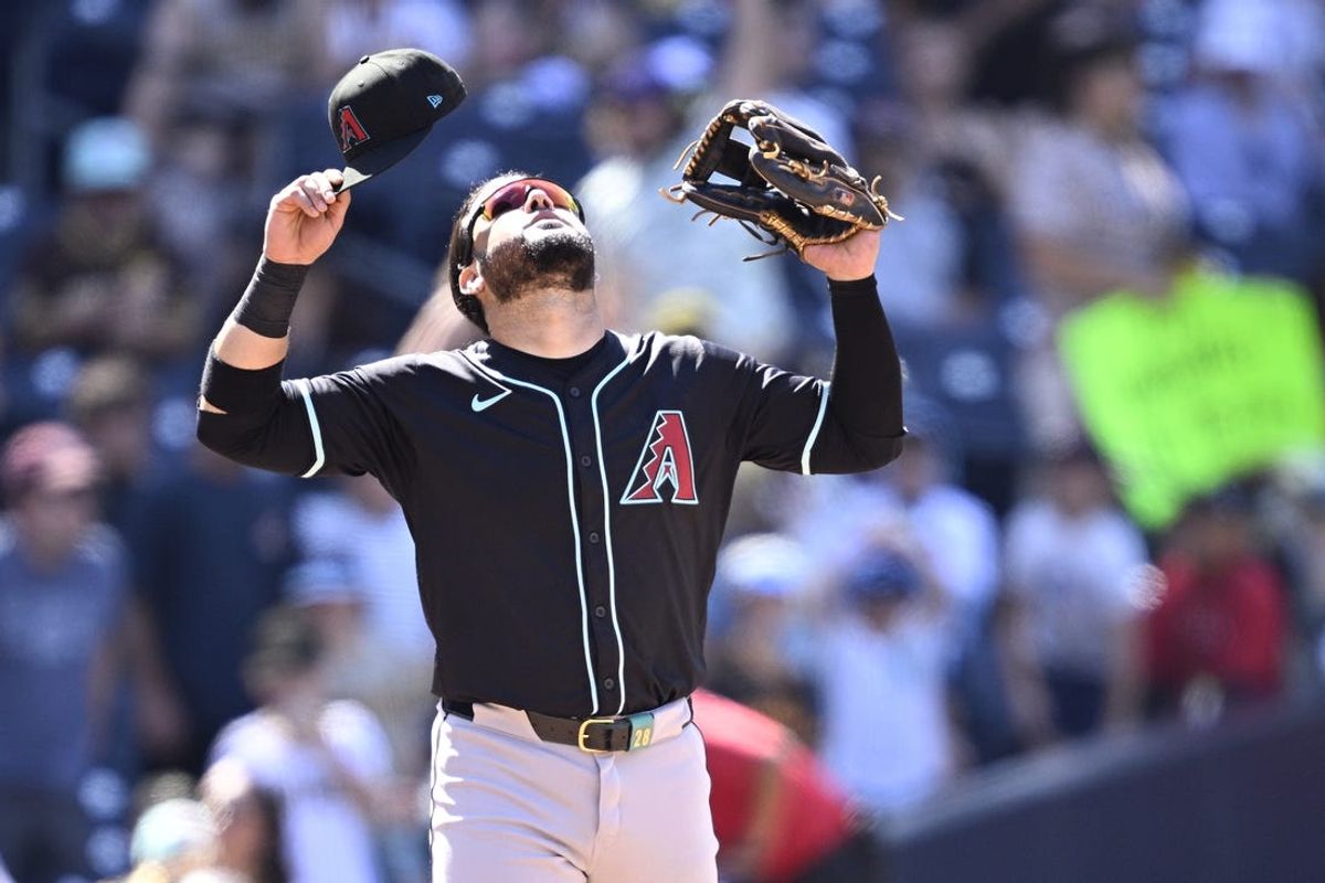 Jul 7, 2024; San Diego, California, USA; Arizona Diamondbacks third baseman Eugenio Suarez (28) celebrates on the field after defeating the San Diego Padres at Petco Park. Mandatory Credit: Orlando Ramirez-USA TODAY Sports