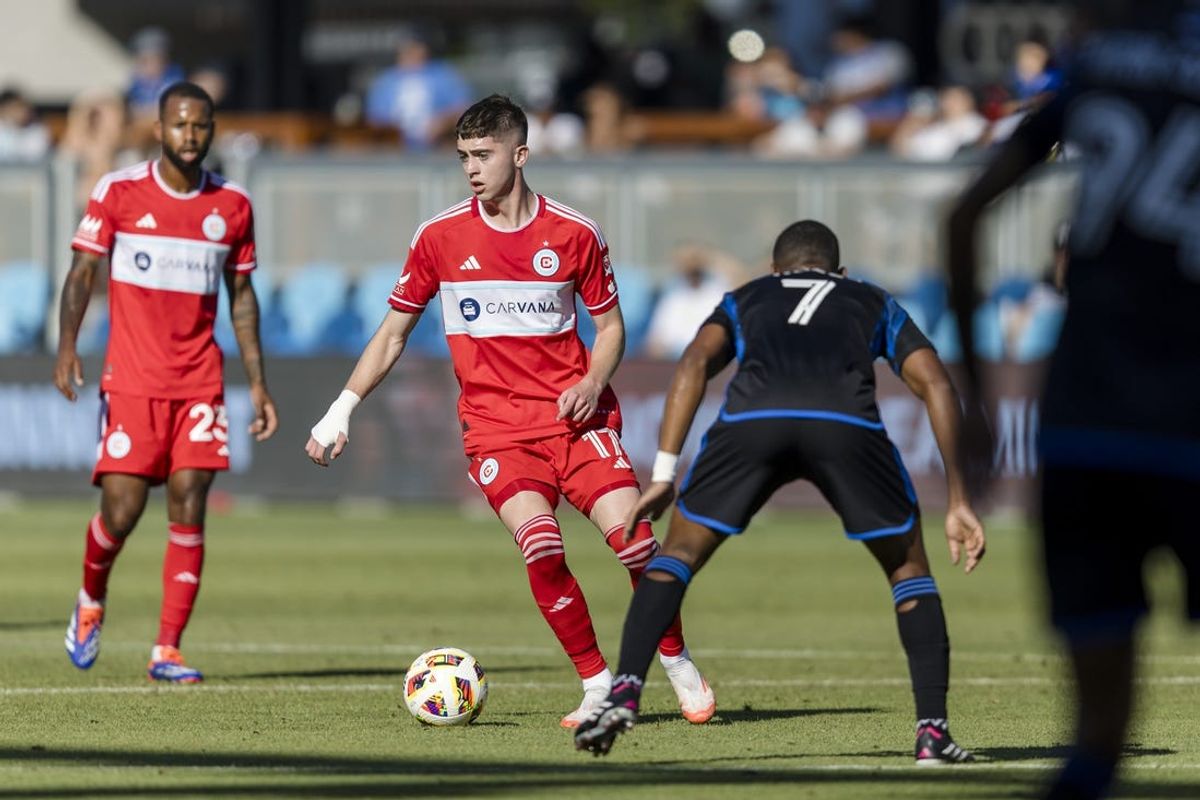 Jul 7, 2024; San Jose, California, USA; Chicago Fire midfielder Brian Gutiérrez (17) passes past San Jose Earthquakes midfielder Carlos Gruezo (7) during the first half at PayPal Park. Mandatory Credit: John Hefti-USA TODAY Sports