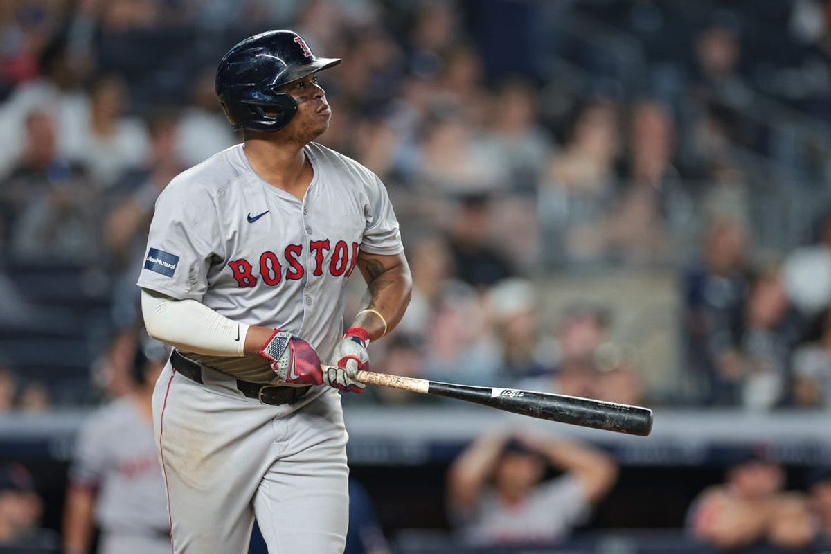 Jul 7, 2024; Bronx, New York, USA; Boston Red Sox third baseman Rafael Devers (11) looks up at his solo home run during the ninth inning against the New York Yankees at Yankee Stadium. Mandatory Credit: Vincent Carchietta-USA TODAY Sports