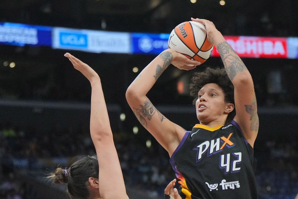 Jul 7, 2024; Los Angeles, California, USA; Phoenix Mercury center Brittney Griner (42) shoots the ball against LA Sparks center Li Yueru (28) in the first half at Crypto.com Arena. Mandatory Credit: Kirby Lee-USA TODAY Sports