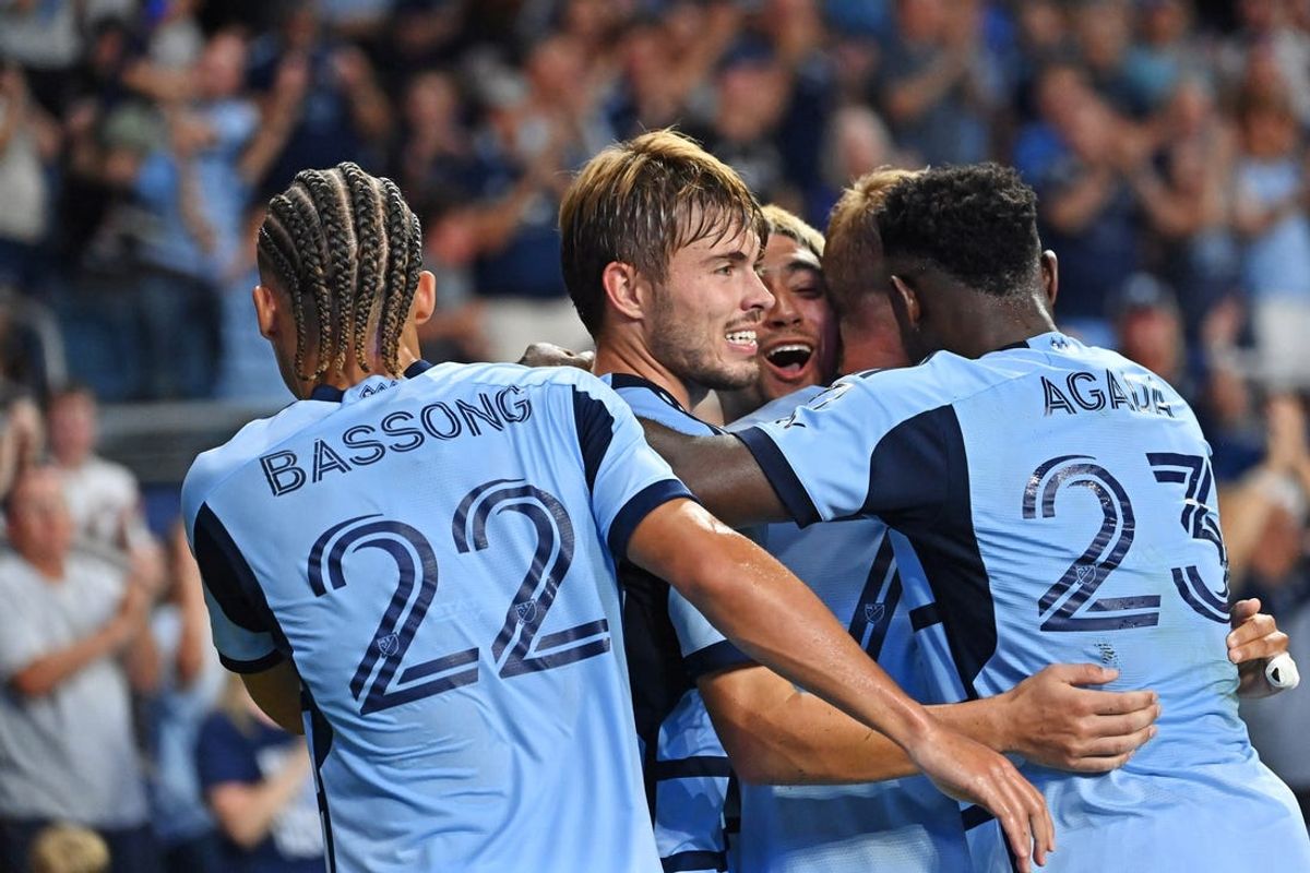 Jul 7, 2024; Kansas City, Kansas, USA; Sporting Kansas City midfielder Memo Rodriguez (8) celebrates after scoring a goal during the second half against FC Dallas at Children's Mercy Park. Mandatory Credit: Peter Aiken-USA TODAY Sports