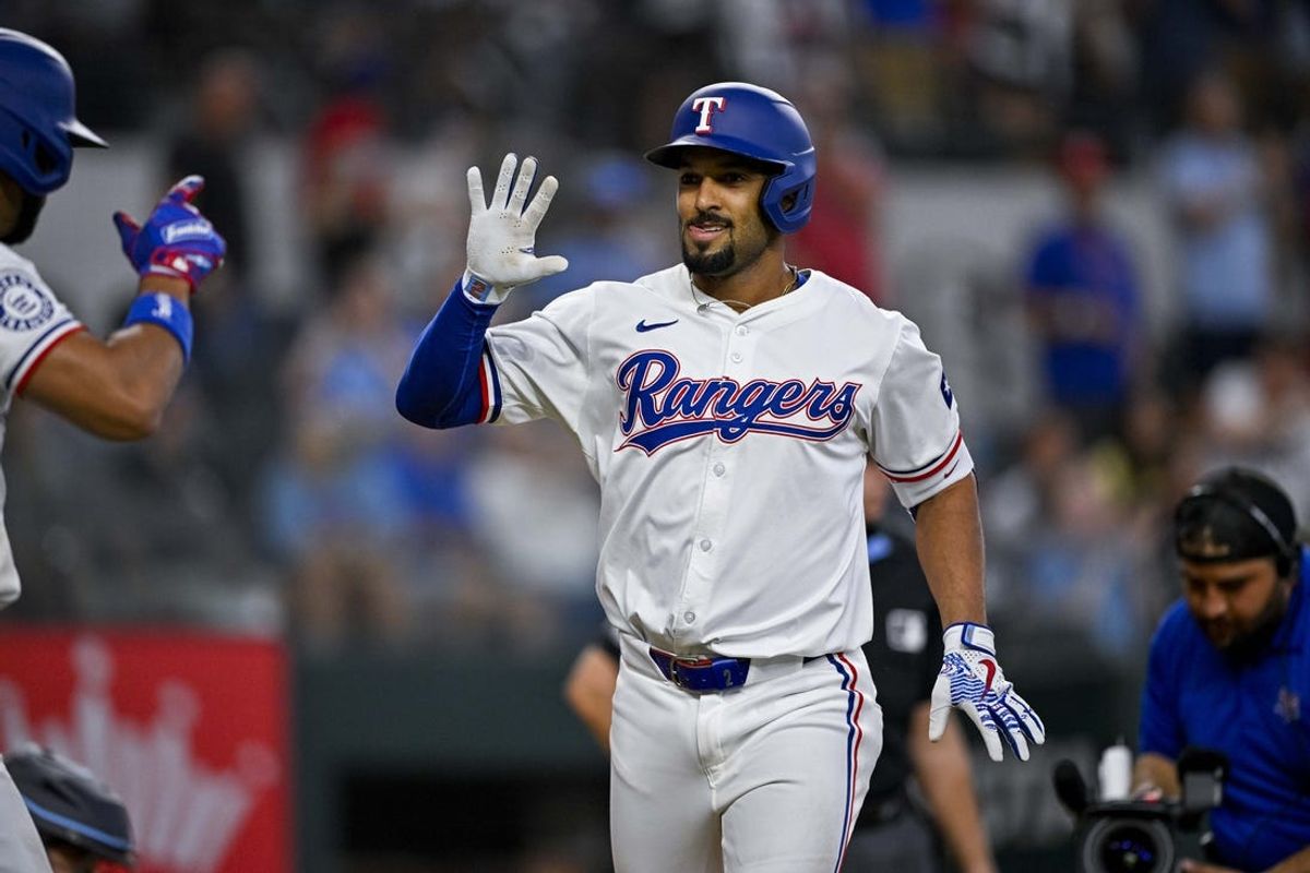 Jul 6, 2024; Arlington, Texas, USA; Texas Rangers second baseman Marcus Semien (2) celebrates during the game between the Texas Rangers and the Tampa Bay Rays at Globe Life Field. Mandatory Credit: Jerome Miron-USA TODAY Sports