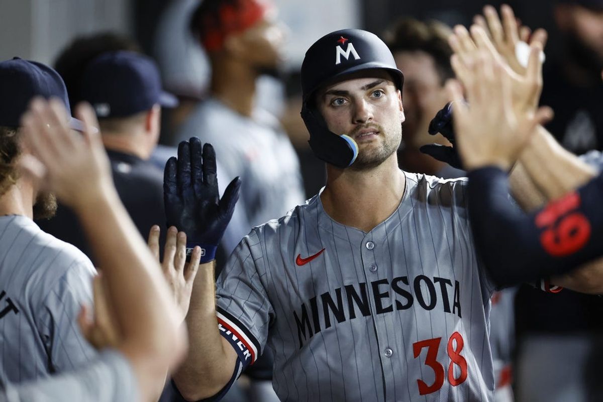 Jul 8, 2024; Chicago, Illinois, USA; Minnesota Twins outfielder Matt Wallner (38) celebrates with teammates in the dugout after hitting a two-run home run against the Chicago White Sox during the seventh inning at Guaranteed Rate Field. Mandatory Credit: Kamil Krzaczynski-USA TODAY Sports