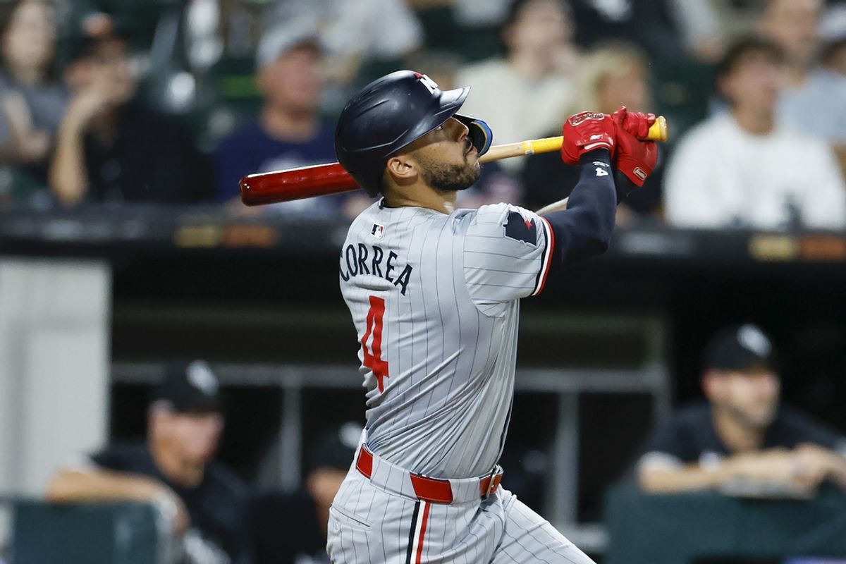 Jul 8, 2024; Chicago, Illinois, USA; Minnesota Twins shortstop Carlos Correa (4) hits a solo home run against the Chicago White Sox during the seventh inning at Guaranteed Rate Field. Mandatory Credit: Kamil Krzaczynski-Imagn Images