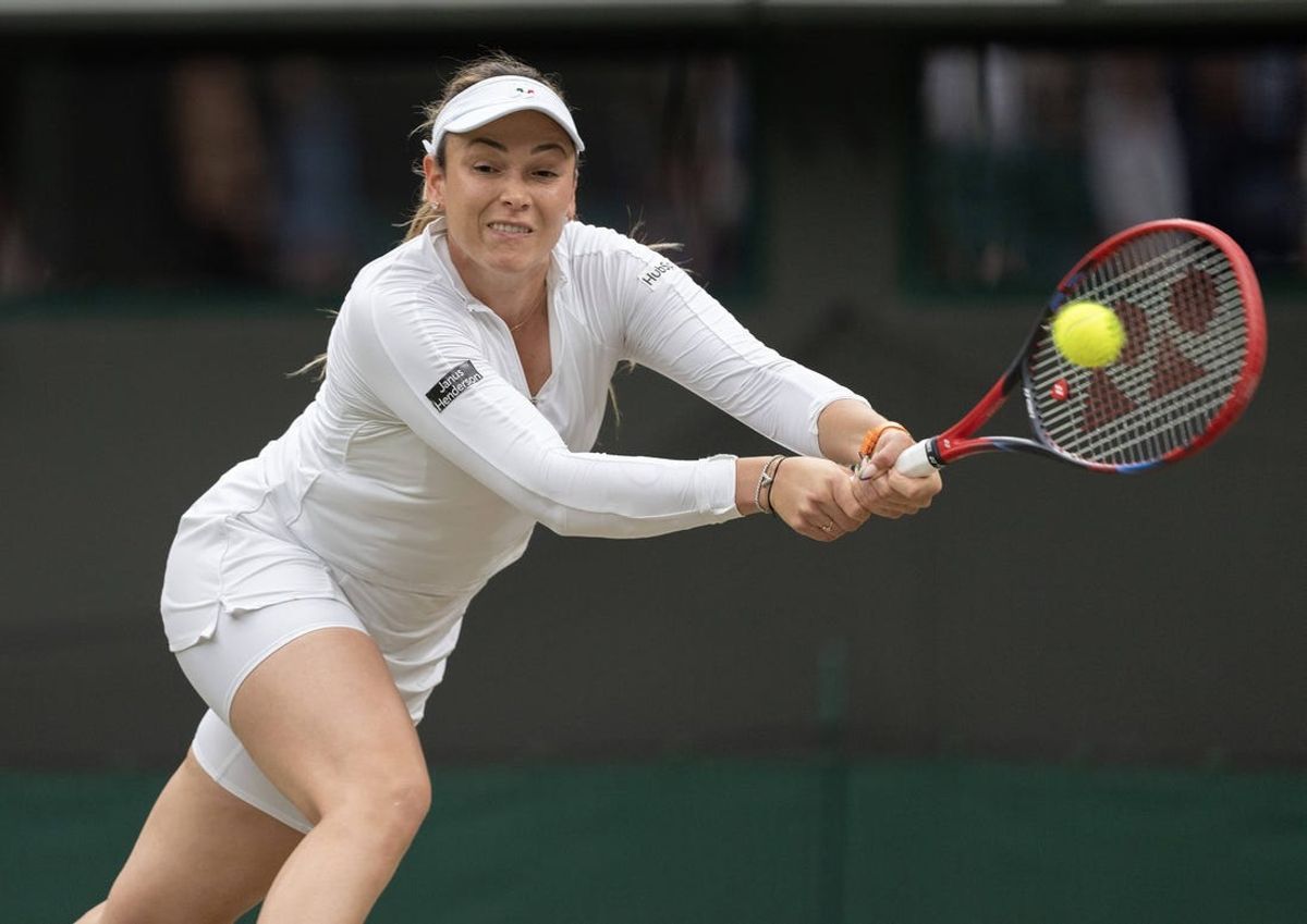 Jul 9, 2024; London, United Kingdom; Donna Vekic of Croatia returns a shot during her match against Lulu Sun of New Zealand (not shown) on day nine of The Championships at All England Lawn Tennis and Croquet Club. Mandatory Credit: Susan Mullane-USA TODAY Sports