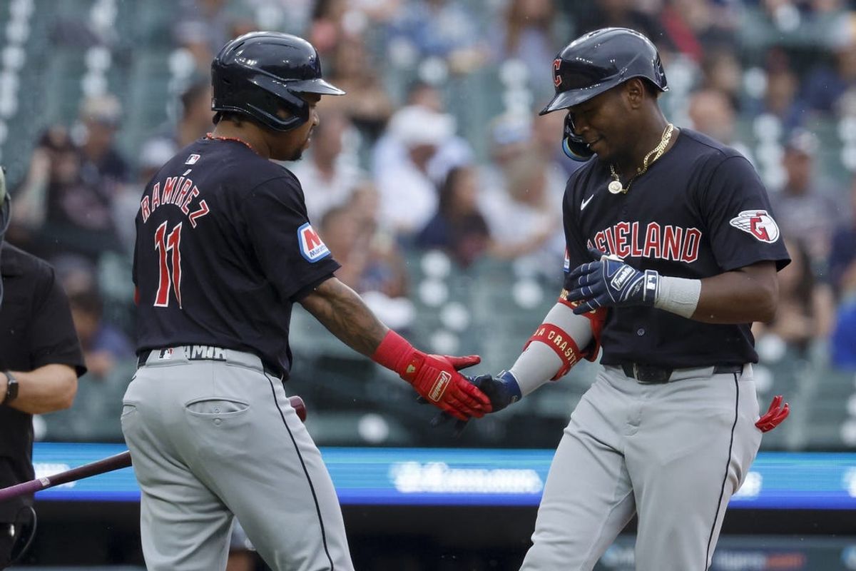 Jul 9, 2024; Detroit, Michigan, USA; Cleveland Guardians Angel Martínez (1) receives congratulations from third base Jose Ramírez (11)  after he hits a home run in the first inning against the Detroit Tigers at Comerica Park. Mandatory Credit: Rick Osentoski-USA TODAY Sports