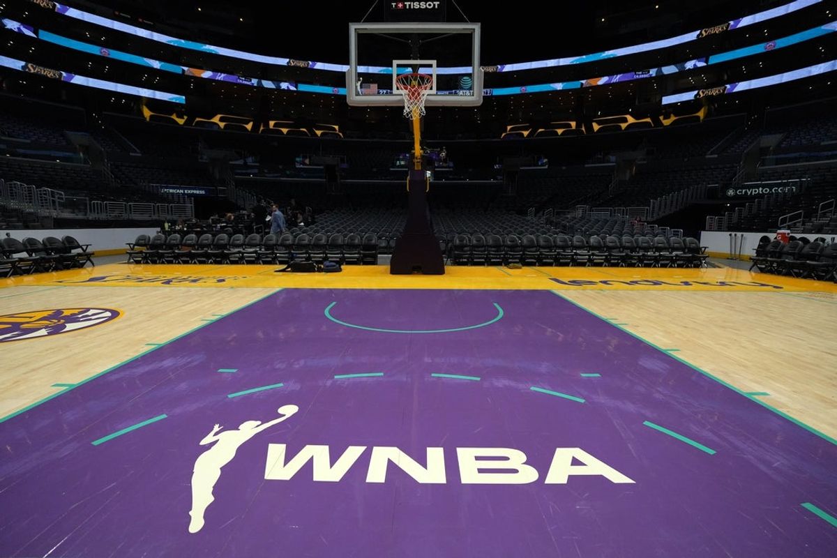 Jul 9, 2024; Los Angeles, California, USA; The WNBA logo on the court at Crypto.com Arena. Mandatory Credit: Kirby Lee-Imagn Images