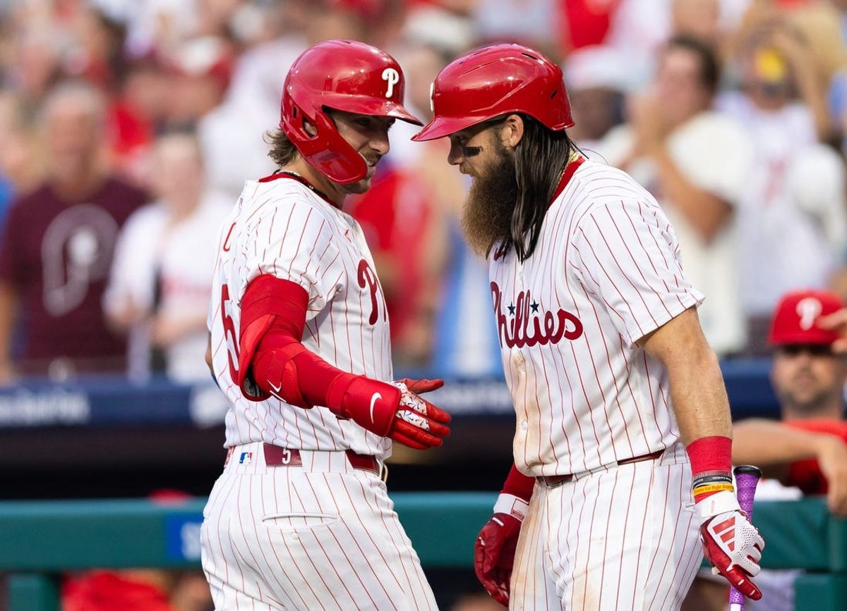 Jul 9, 2024; Philadelphia, Pennsylvania, USA; Philadelphia Phillies second base Bryson Stott (5) celebrates with outfielder Brandon Marsh (16) after hitting a home run during the fourth inning against the Los Angeles Dodgers at Citizens Bank Park. Mandatory Credit: Bill Streicher-USA TODAY Sports