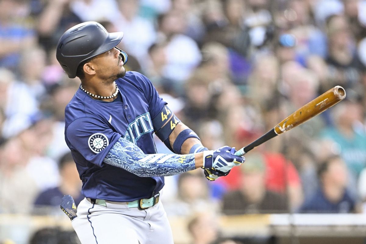 Jun 9, 2024; San Diego, California, USA; Seattle Mariners center fielder Julio Rodriguez (44) hits a solo home run during the fifth inning against the San Diego Padres at Petco Park. Mandatory Credit: Denis Poroy-USA TODAY Sports at Petco Park.