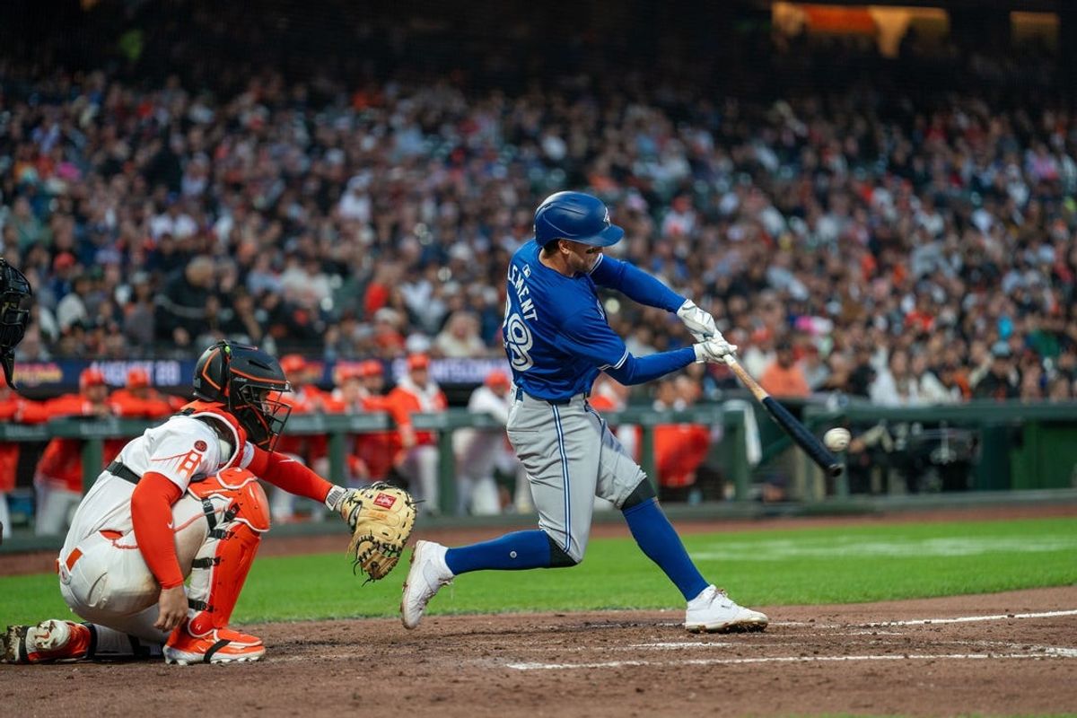 Jul 9, 2024; San Francisco, California, USA;  Toronto Blue Jays third baseman Ernie Clement (28) hits a three run homer against the San Francisco Giants during the seventh inning at Oracle Park. Mandatory Credit: Neville E. Guard-USA TODAY Sports