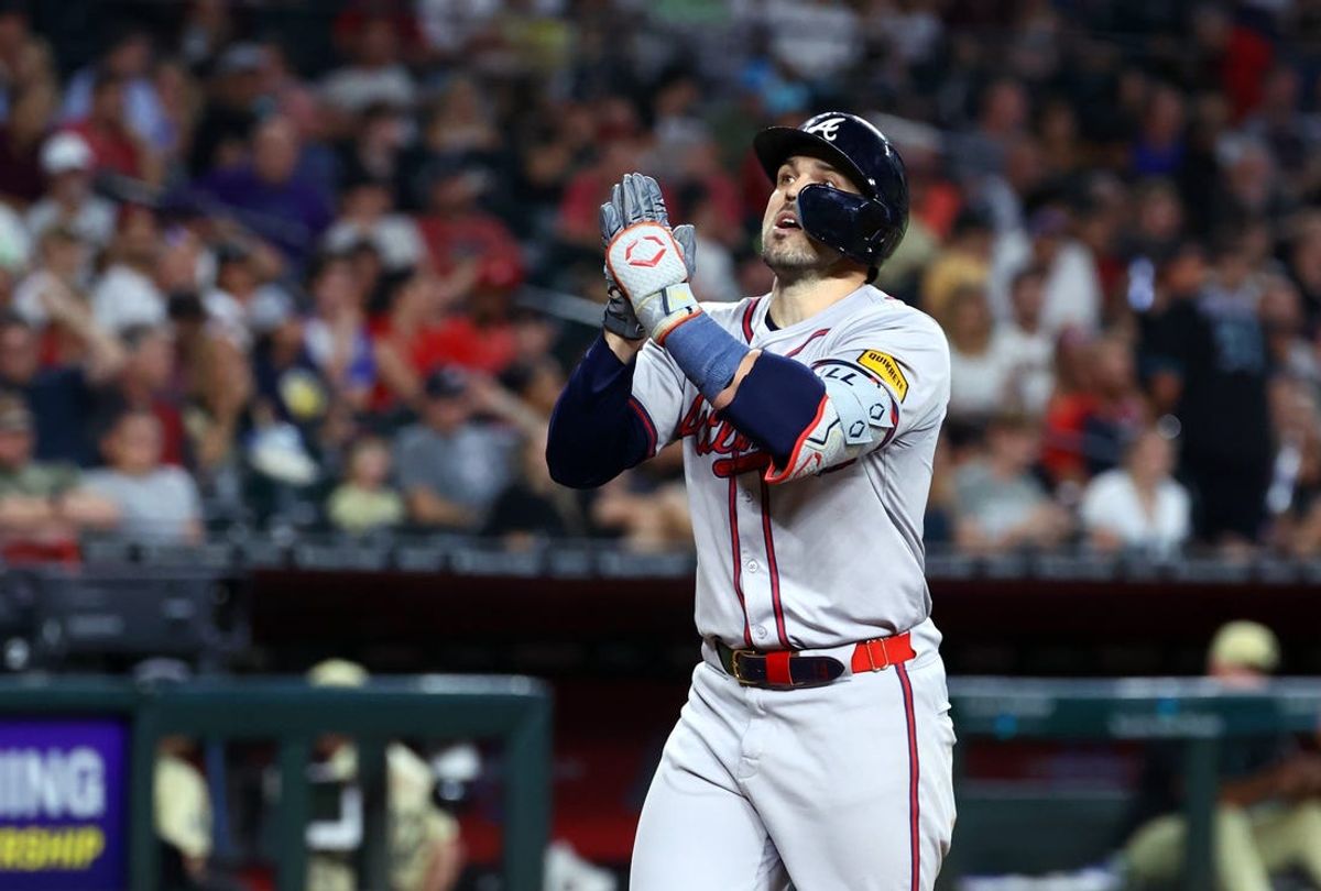 Jul 9, 2024; Phoenix, Arizona, USA; Atlanta Braves outfielder Adam Duvall celebrates after hitting a three run home run in the sixth inning against the Arizona Diamondbacks at Chase Field. Mandatory Credit: Mark J. Rebilas-USA TODAY Sports