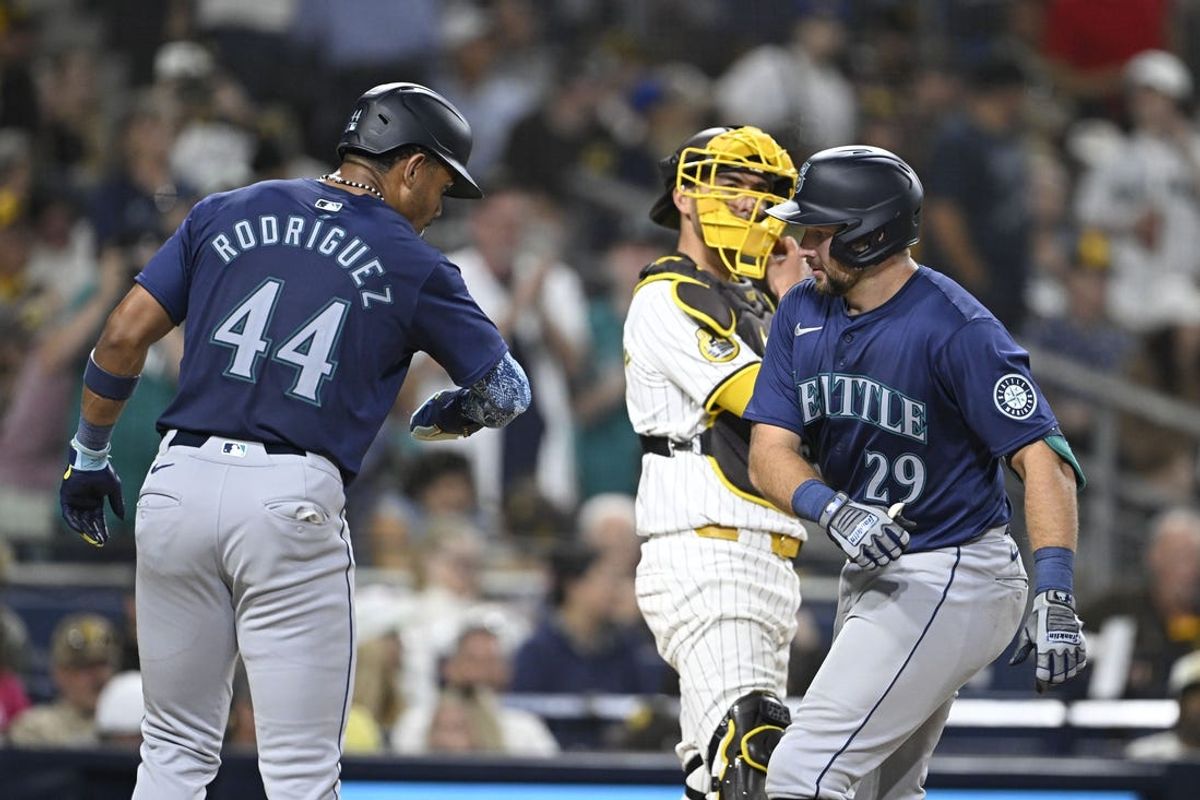Jun 9, 2024; San Diego, California, USA; Seattle Mariners catcher Cal Raleigh (29) is congratulated by Julio Rodriguez (44) after hitting a two-run home run during the seventh inning against the San Diego Padres at Petco Park. Mandatory Credit: Denis Poroy-USA TODAY Sports at Petco Park.