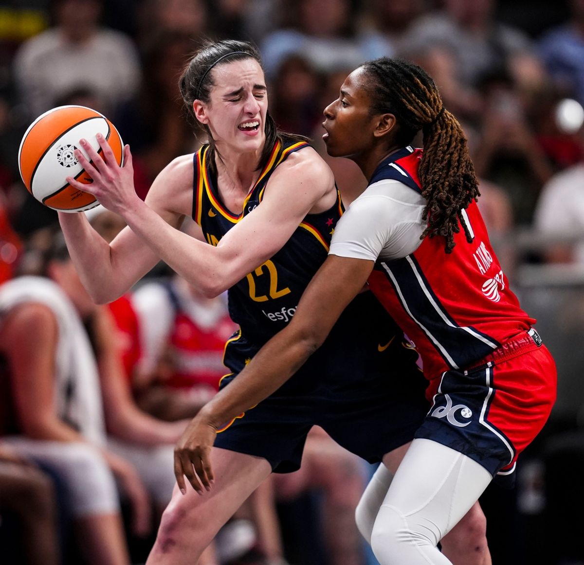 Washington Mystics guard Ariel Atkins (7) guards Indiana Fever guard Caitlin Clark (22) Wednesday, July 10, 2024, during the game at Gainbridge Fieldhouse in Indianapolis.
