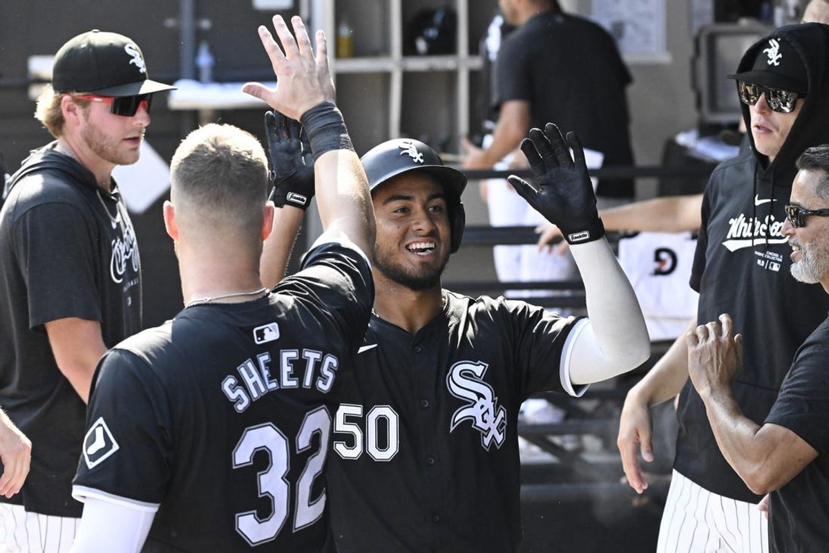 Jul 10, 2024; Chicago, Illinois, USA;  Chicago White Sox third base Lenyn Sosa (50) celebrates with teammates after scoring against the Minnesota Twins during the second inning at Guaranteed Rate Field. Mandatory Credit: Matt Marton-USA TODAY Sports