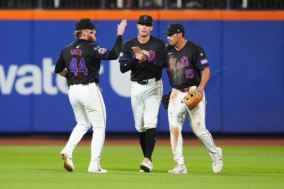 Jul 10, 2024; New York City, New York, USA; New York Mets center fielder Harrison Bader (44), left fielder Brandon Nimmo (9) and center fielder Tyrone Taylor (15) celebrate a victory against the Washington Nationals at Citi Field. Mandatory Credit: Gregory Fisher-USA TODAY Sports