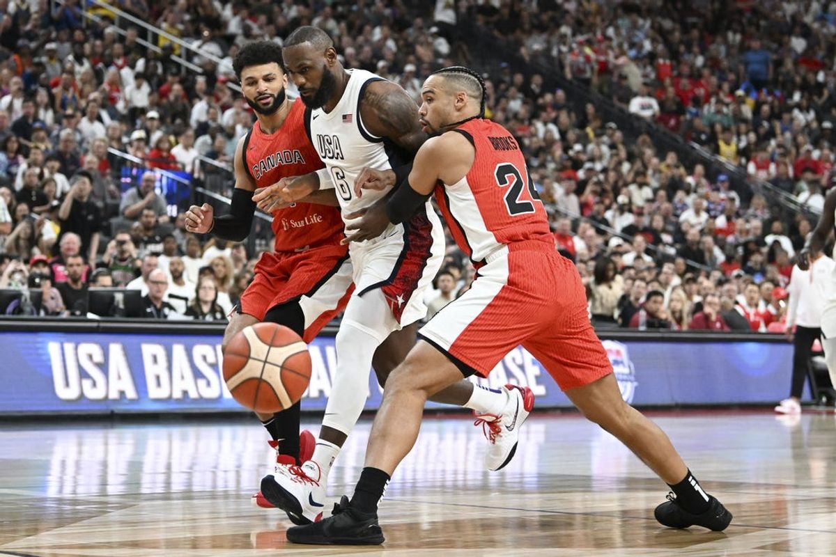 Jul 10, 2024; Las Vegas, Nevada, USA; USA forward Lebron James (6) collides with Canada guard Jamal Murray (4) and forward Dillion Brooks (24) in the first quarter of the USA Basketball Showcase at T-Mobile Arena. Mandatory Credit: Candice Ward-USA TODAY Sports