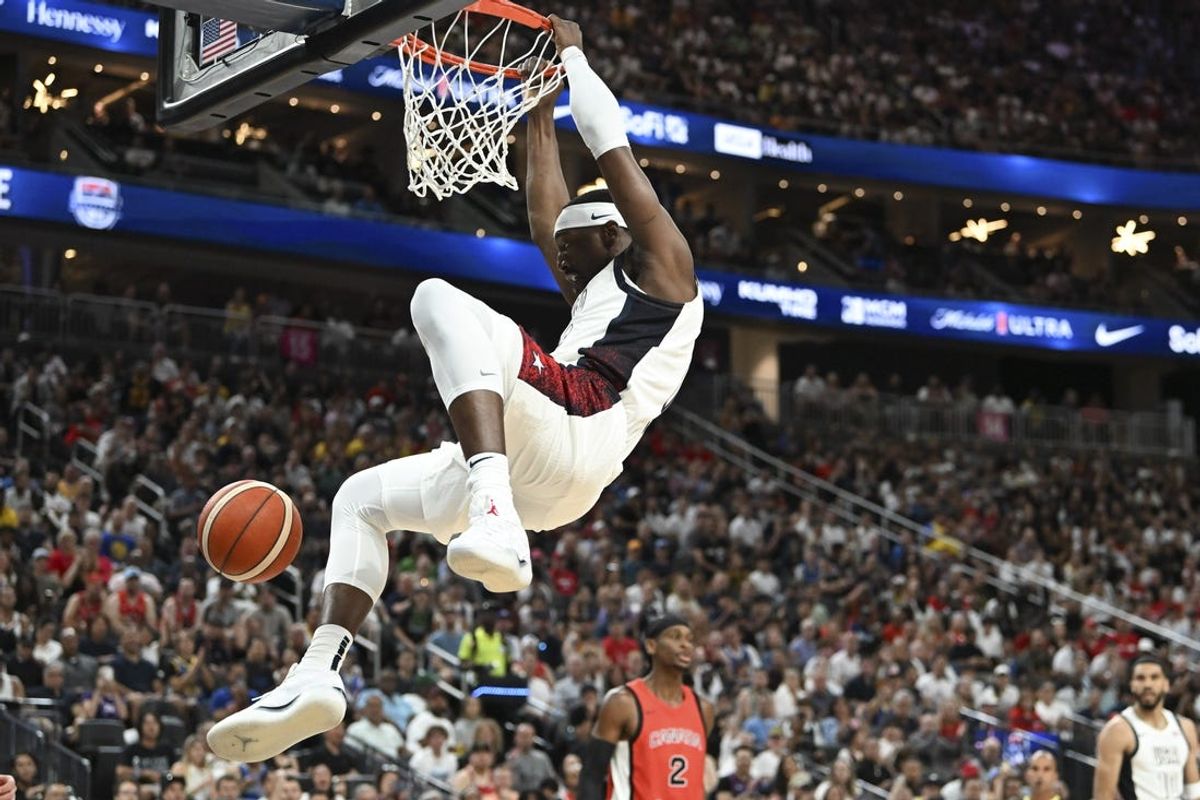 Jul 10, 2024; Las Vegas, Nevada, USA; USA forward Bam Adebayo (13) dunks on Canada in the first quarter of the USA Basketball Showcase at T-Mobile Arena. Mandatory Credit: Candice Ward-USA TODAY Sports
