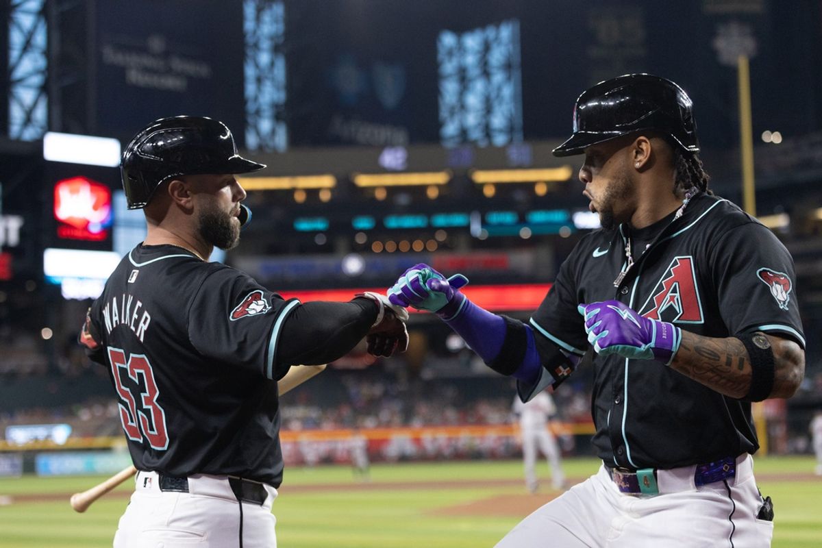 Arizona Diamondbacks second baseman Ketel Marte (4) celebrates with Arizona Diamondbacks first baseman Christian Walker (53) after hitting a solo home run on July 10, 2024 at Chase Field in Phoenix.
