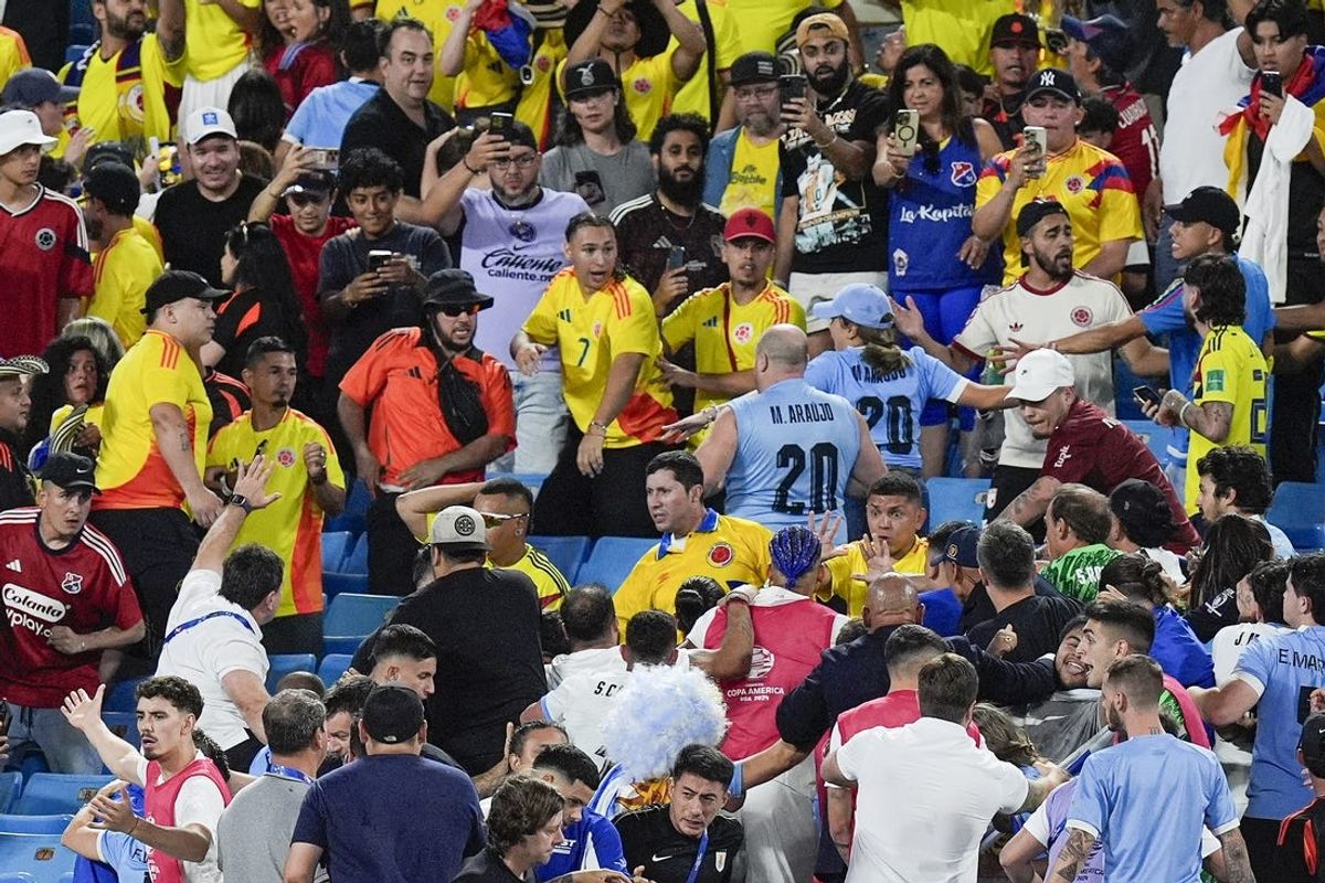 Jul 10, 2024; Charlotte, NC, USA;  Fans get into an altercation with players and staff from Uruguay after the Copa Armerica Semifinal match between Uruguay and Colombia at Bank of America Stadium. Mandatory Credit: Jim Dedmon-USA TODAY Sports