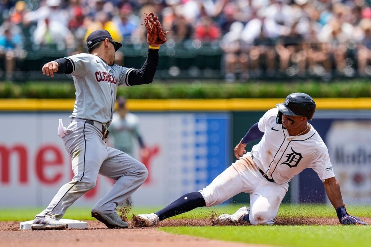 Detroit Tigers right fielder Wenceel Pérez (46) slides into second base against Cleveland Guardians second base Andrés Giménez (0) during the first inning at Comerica Park in Detroit on Thursday, July 11, 2024.
