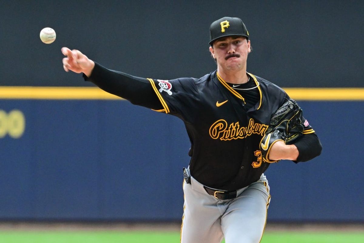 Jul 11, 2024; Milwaukee, Wisconsin, USA; Pittsburgh Pirates starting pitcher Paul Skenes (30) pitches in the first inning against the Milwaukee Brewers at American Family Field. Mandatory Credit: Benny Sieu-USA TODAY Sports