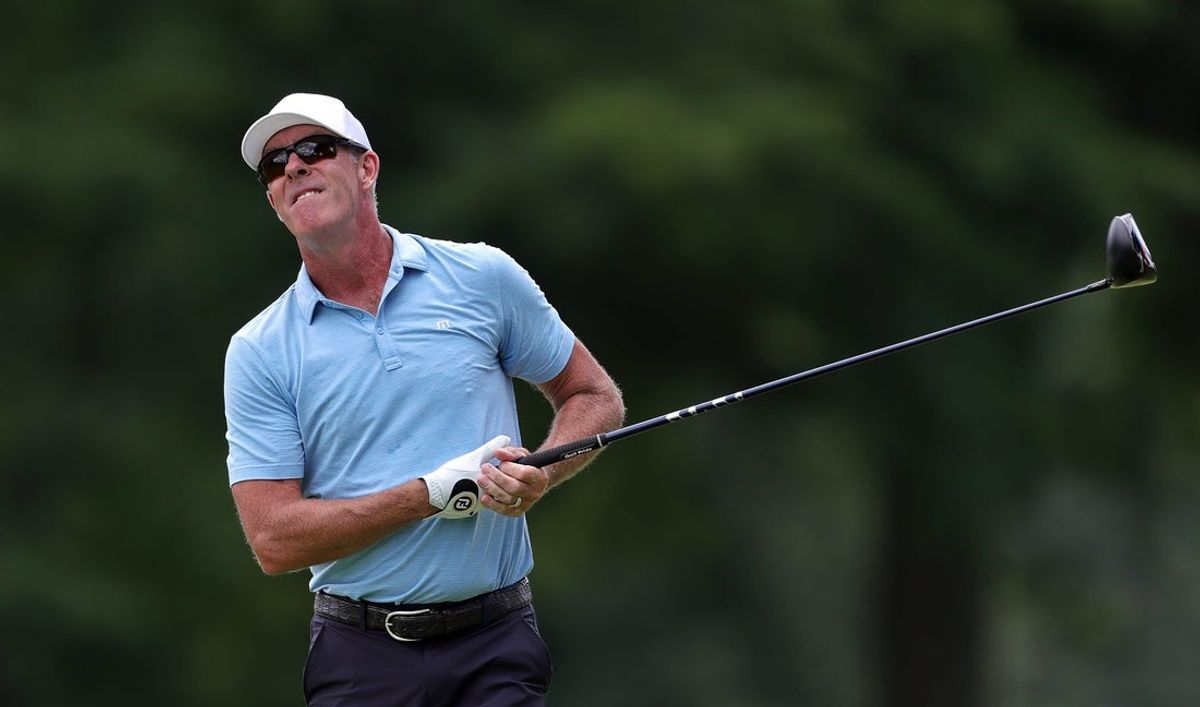 Richard Green watches his shot from the tee on the third hole during the first round of the Kaulig Companies Championship at Firestone Country Club, Thursday, July 11, 2024, in Akron, Ohio.