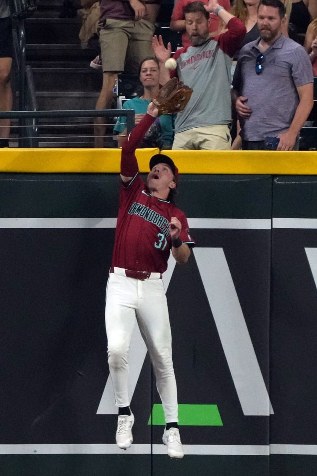 Jul 11, 2024; Phoenix, Arizona, USA; Arizona Diamondbacks outfielder Jake McCarthy (31) makes the catch for an out against the Atlanta Braves in the ninth inning at Chase Field. Mandatory Credit: Rick Scuteri-USA TODAY Sports