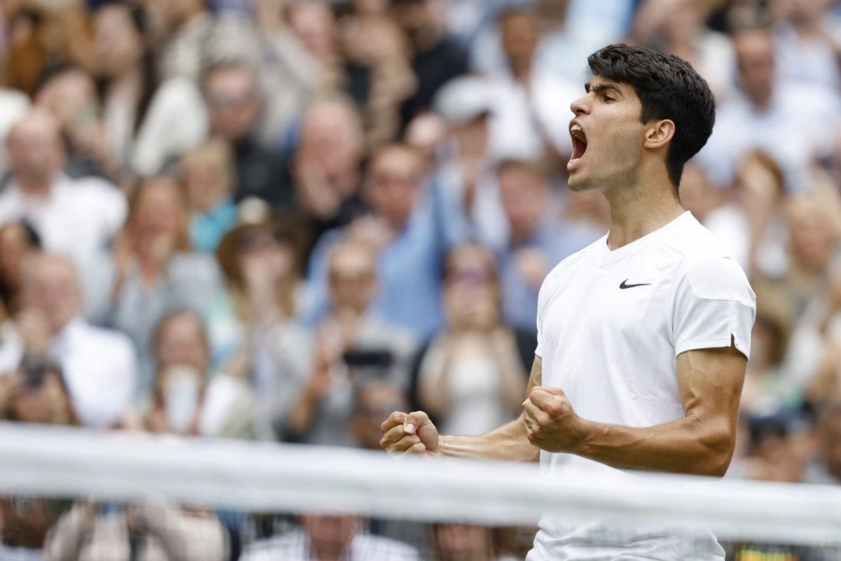 Jul 12, 2024; London, United Kingdom; Carlos Alcaraz (ESP) celebrates after his match against Daniil Medvedev (not pictured) in a gentlemen's singles semifinal on day twelve of The Championships Wimbledon 2024 at The All England Lawn Tennis and Croquet Club. Mandatory Credit: Geoff Burke-USA TODAY Sports