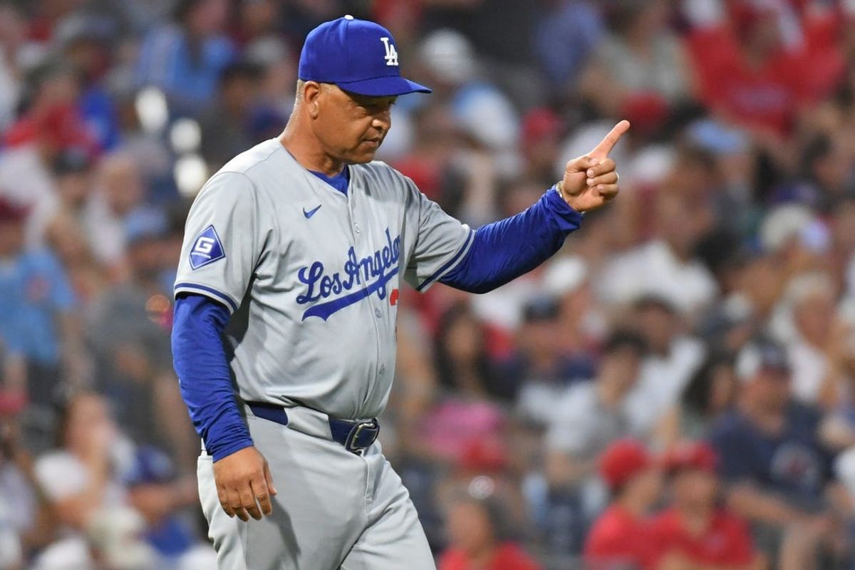 Jul 10, 2024; Philadelphia, Pennsylvania, USA; Los Angeles Dodgers manager Dave Roberts (30) signals to the bullpen to make a pitching change against the Philadelphia Phillies at Citizens Bank Park. Mandatory Credit: Eric Hartline-USA TODAY Sports