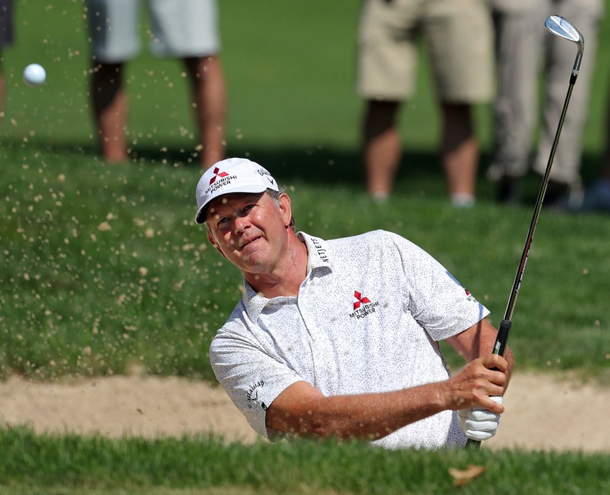 Retief Goosen plays a shot from a bunker on the tenth hole during the second round of the Kaulig Companies Championship at Firestone Country Club, Friday, July 12, 2024, in Akron, Ohio.